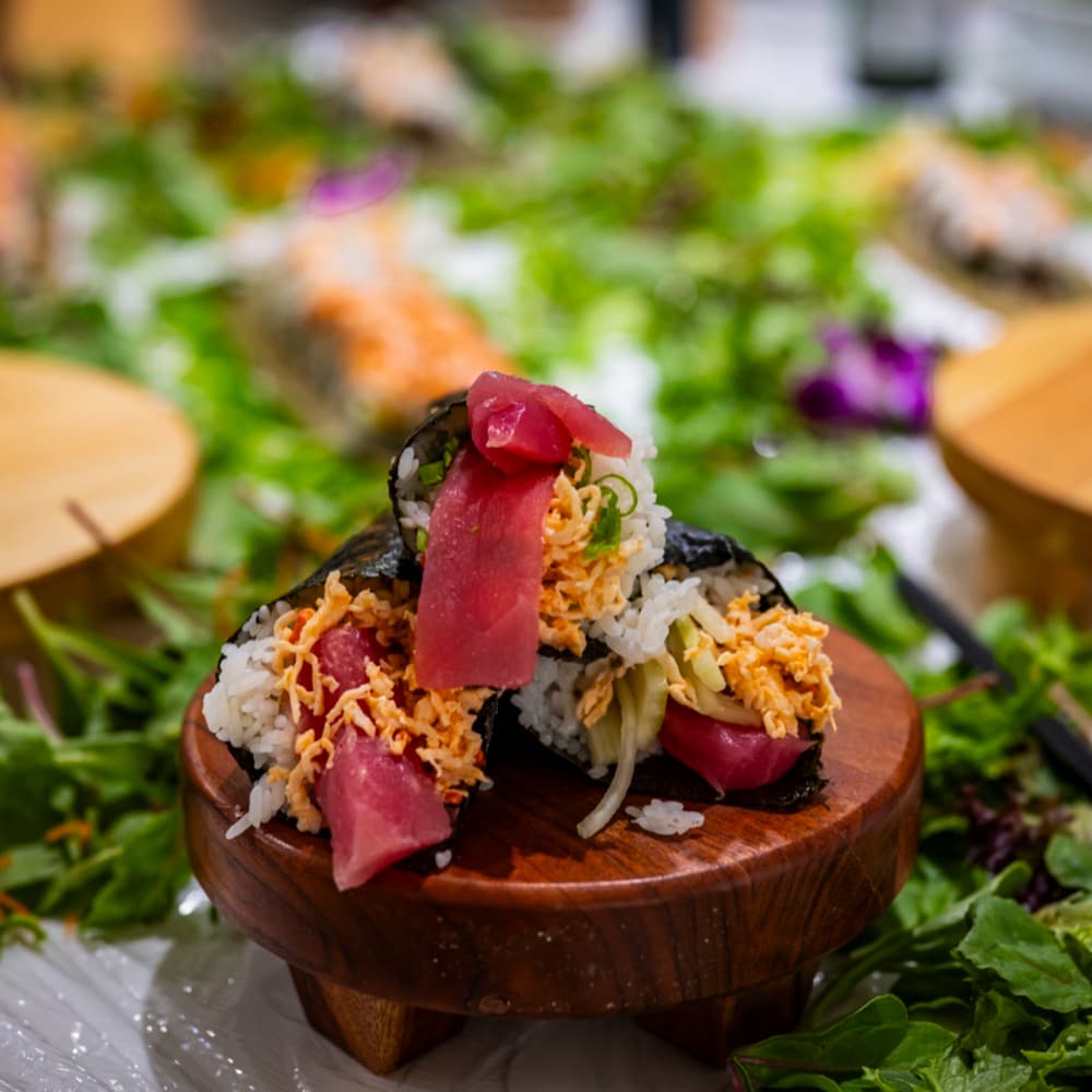A plated selection of nigiri and sushi rolls.